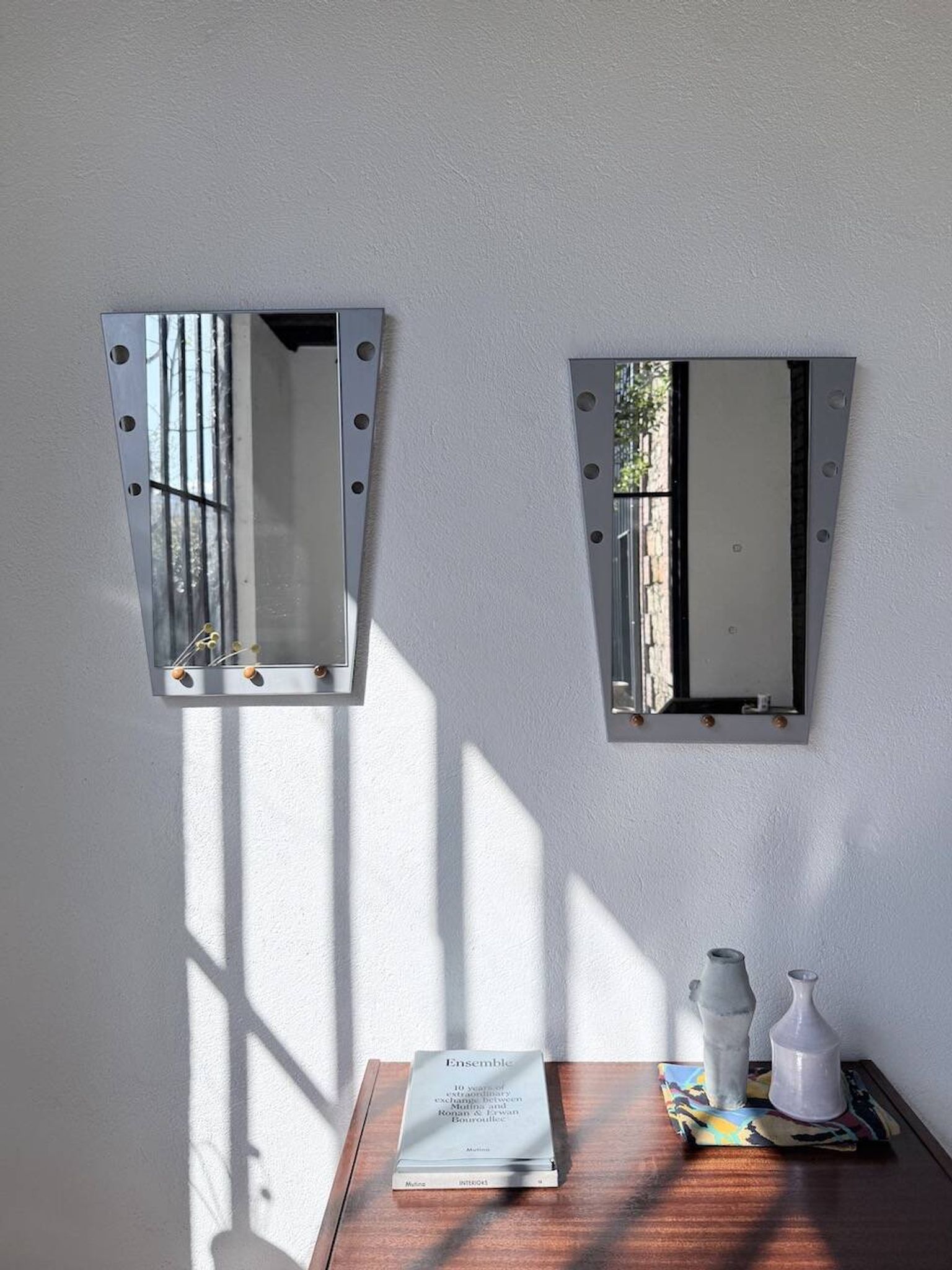 Pair of "Memphis" mirrors from the 80s in chrome and wood.