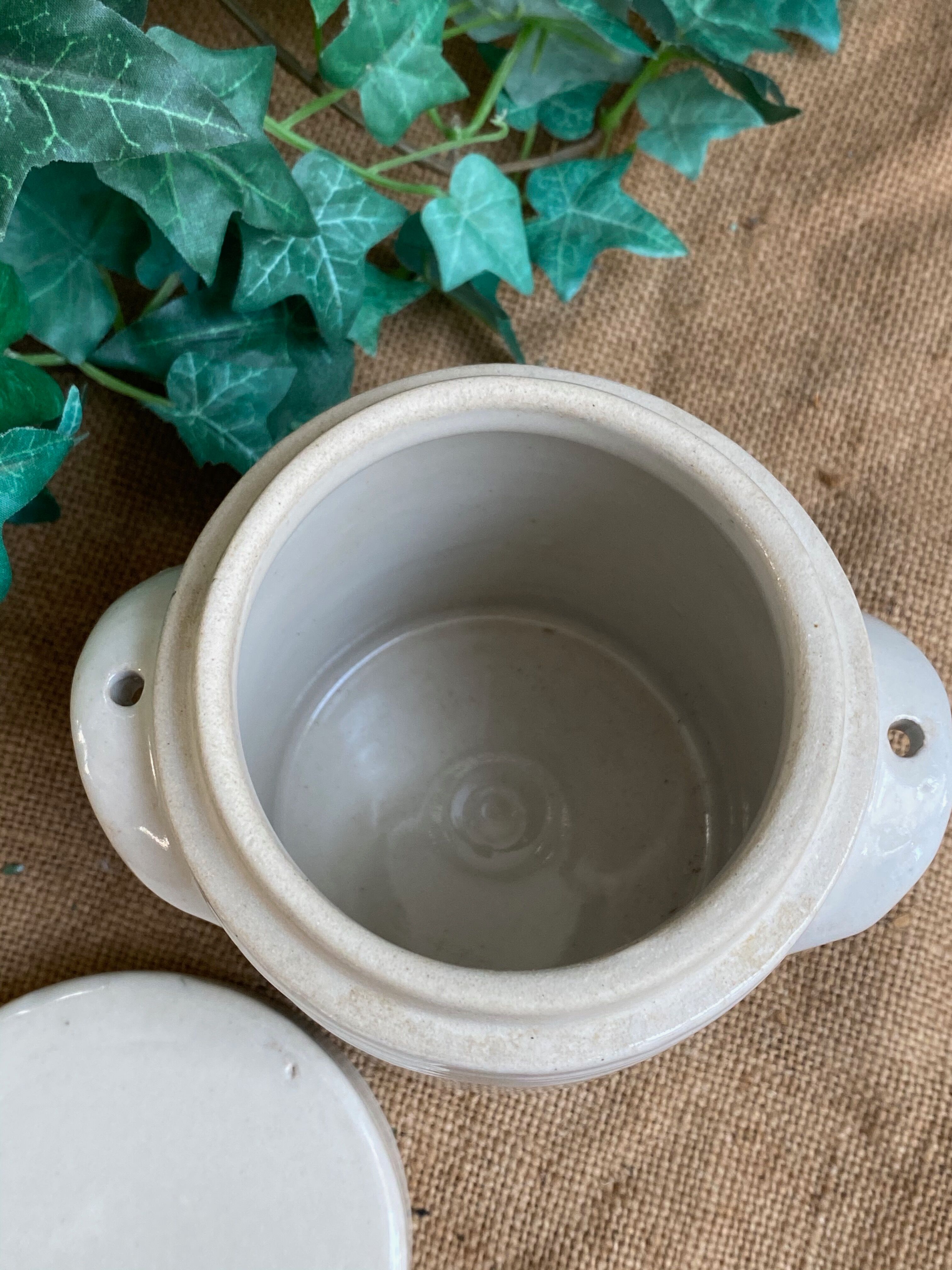 White pot in glazed earth
