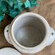 White pot in glazed earth