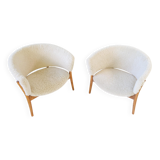 Mid-century lounge chairs in sheepskin/shearling and stained wood, Sweden, 1962.