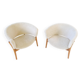 Mid-century lounge chairs in sheepskin/shearling and stained wood, Sweden, 1962.