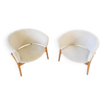 Mid-century lounge chairs in sheepskin/shearling and stained wood, Sweden, 1962.