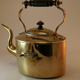 Old kettle with copper stove