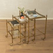 Set of 3 vintage Hollywood Regency nesting tables with brass frame and glass tops (1960s)