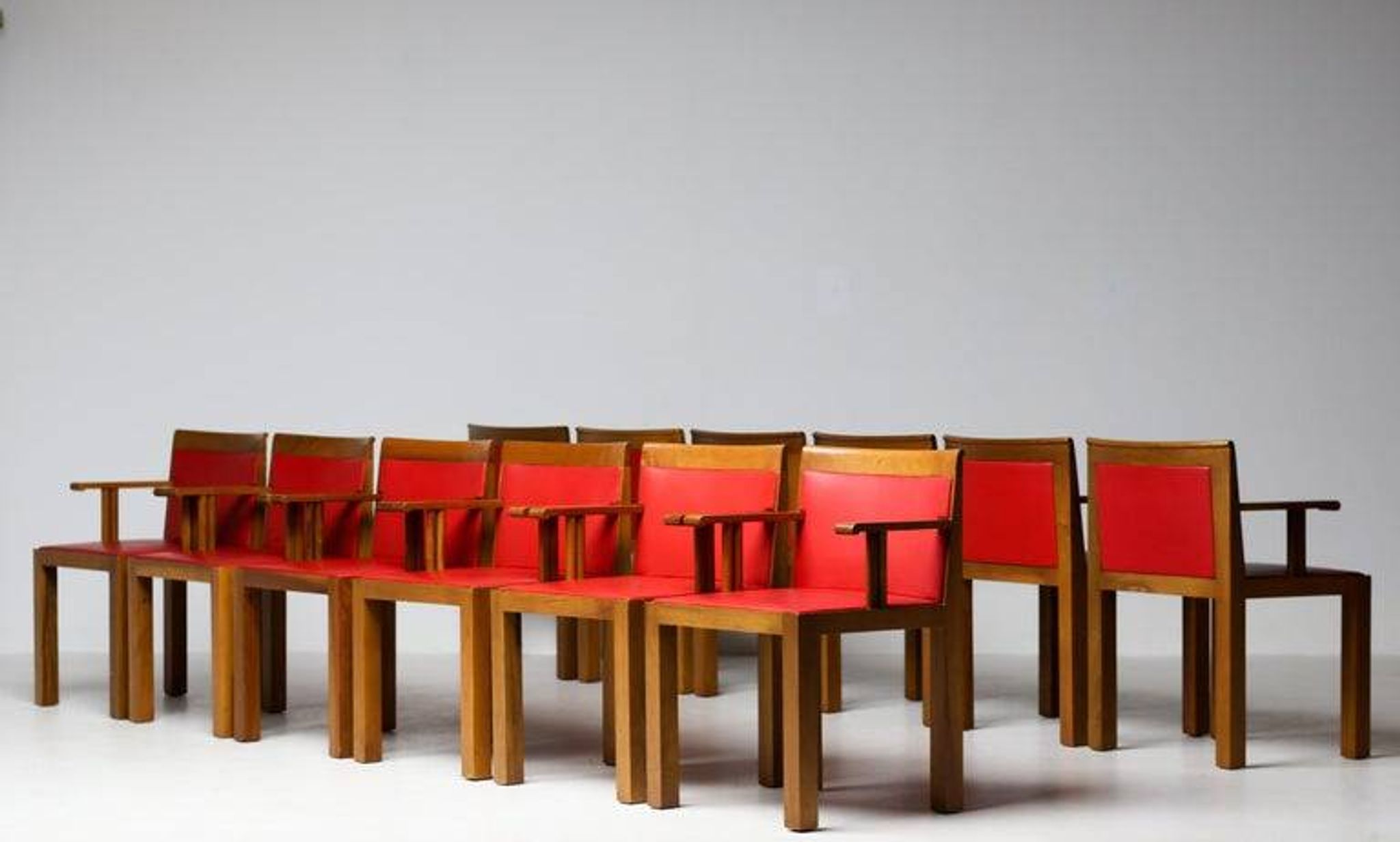 A masterpiece of Italian modernism: eleven Aldo Rossi red Teatro arm chairs
