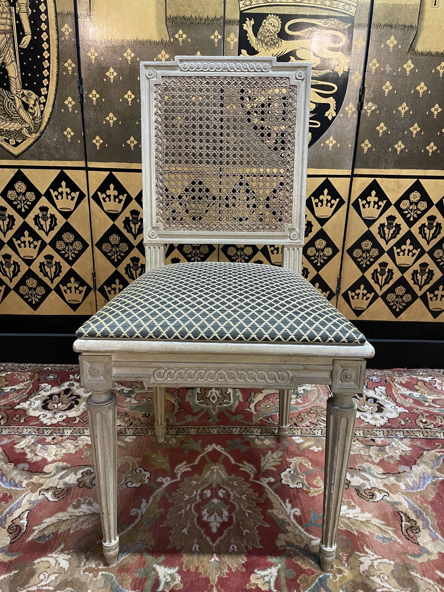 Suite de 4 chaises cannées style Louis XVI Jean Mocque