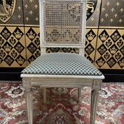 Suite de 4 chaises cannées style Louis XVI Jean Mocque