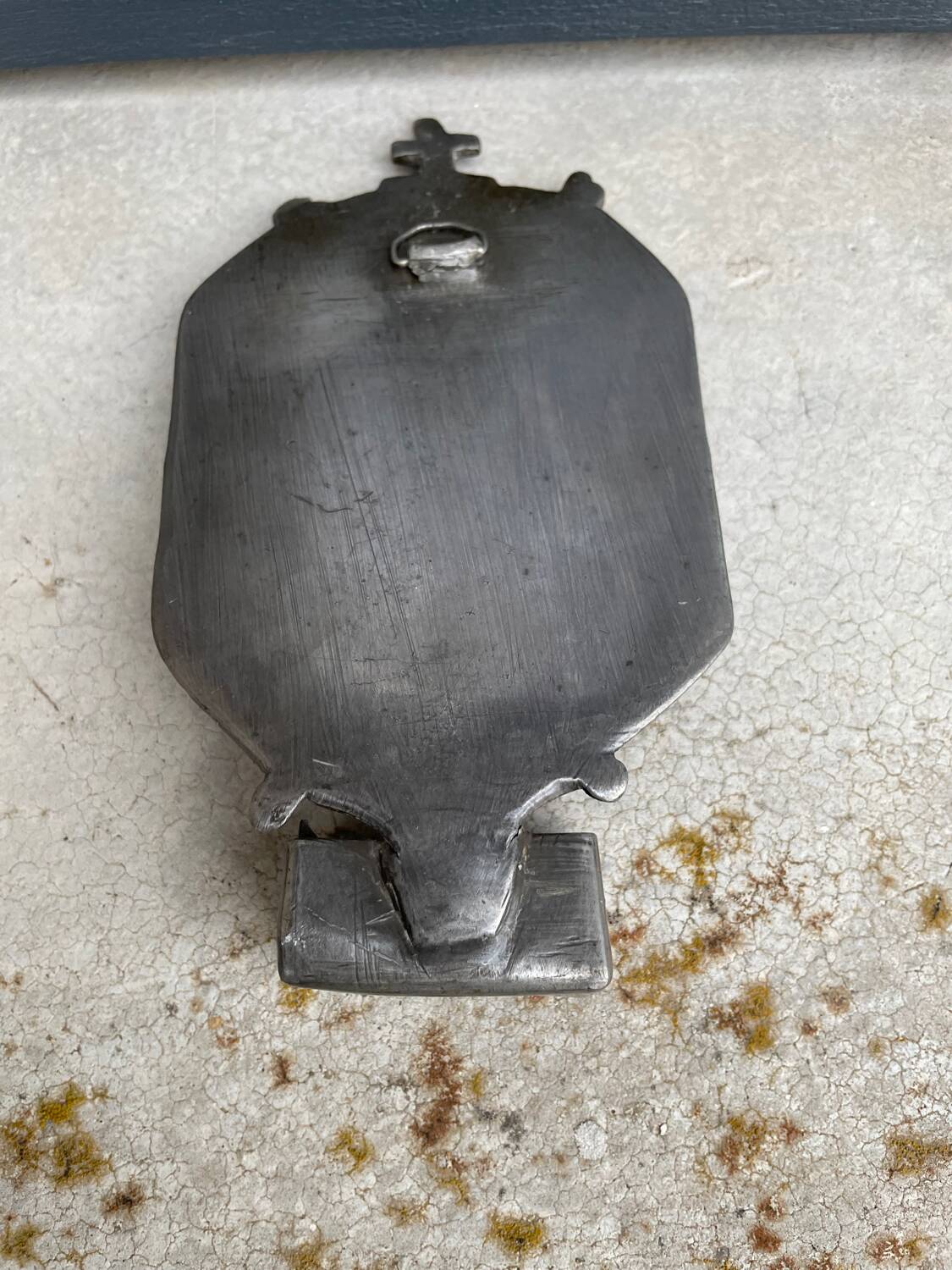 Small wall-mounted holy water font