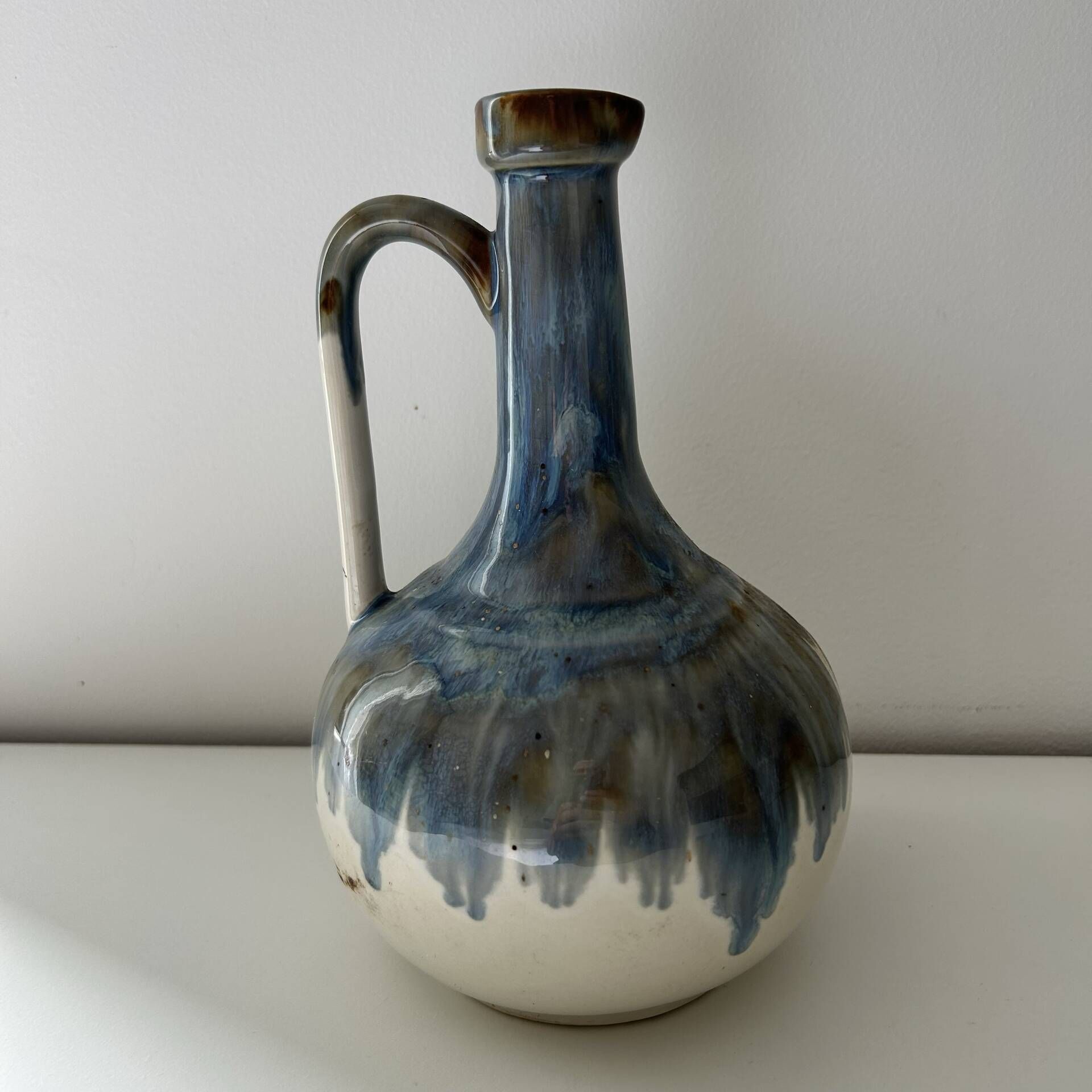 Cherry-decorated earthenware carafe
