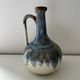 Cherry-decorated earthenware carafe