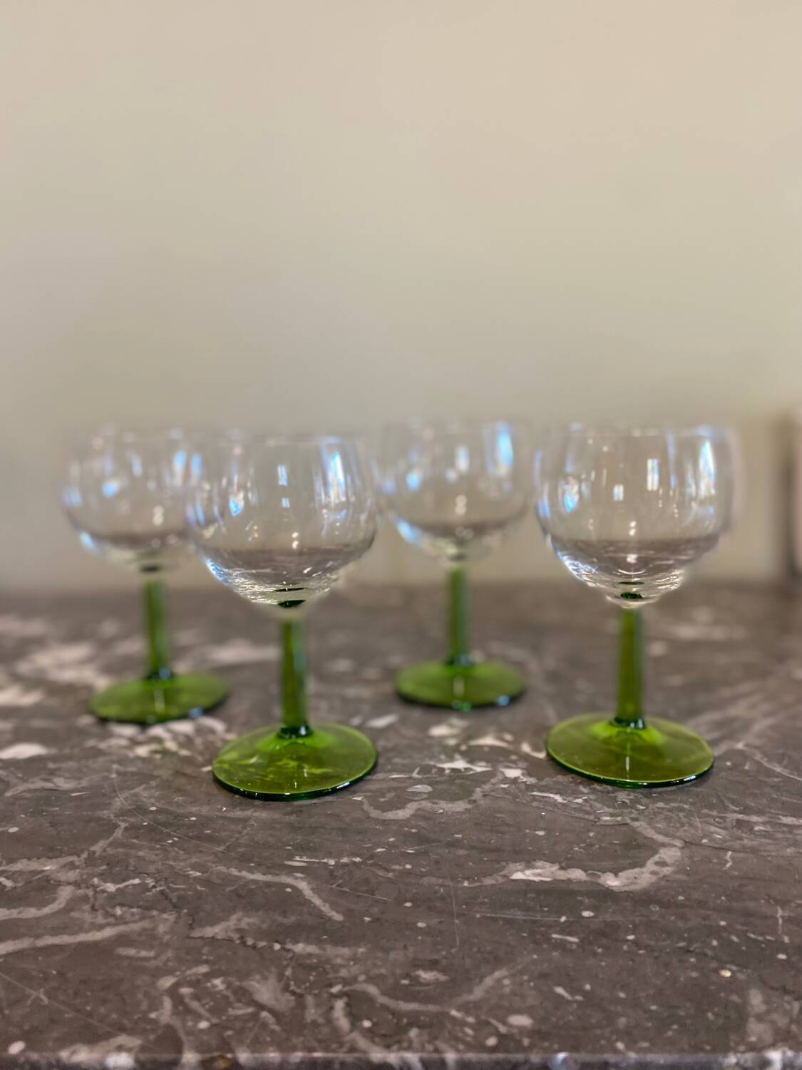 4 green stemmed glasses