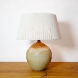 Large stone lamp with a cotton shade.