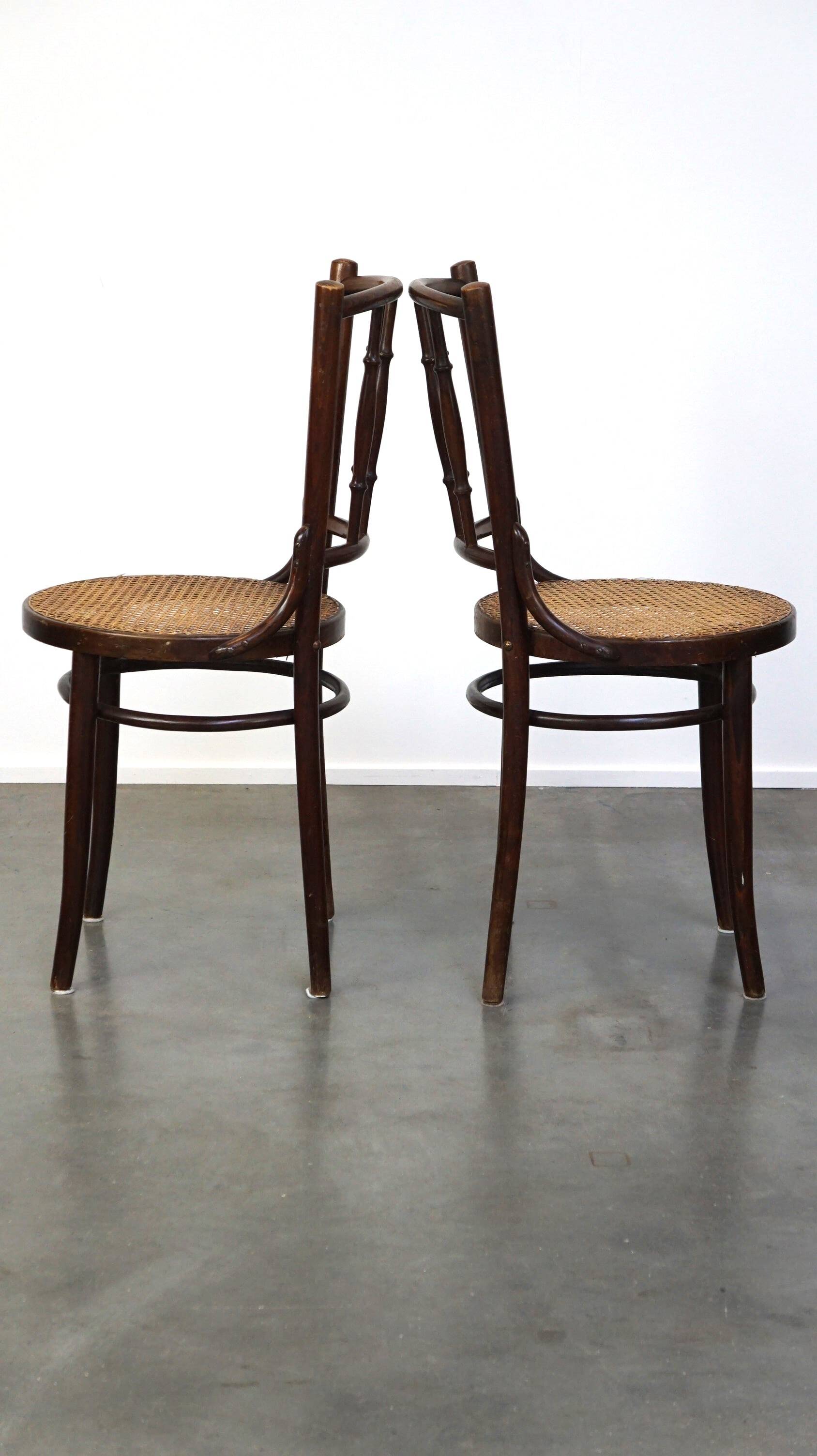 4 antique wooden and cane bistro chairs