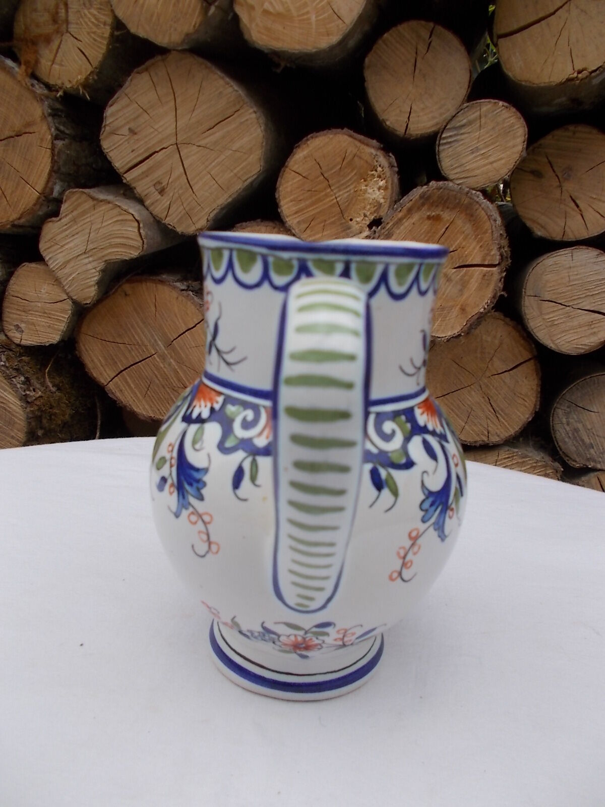 Decorated earthenware jug