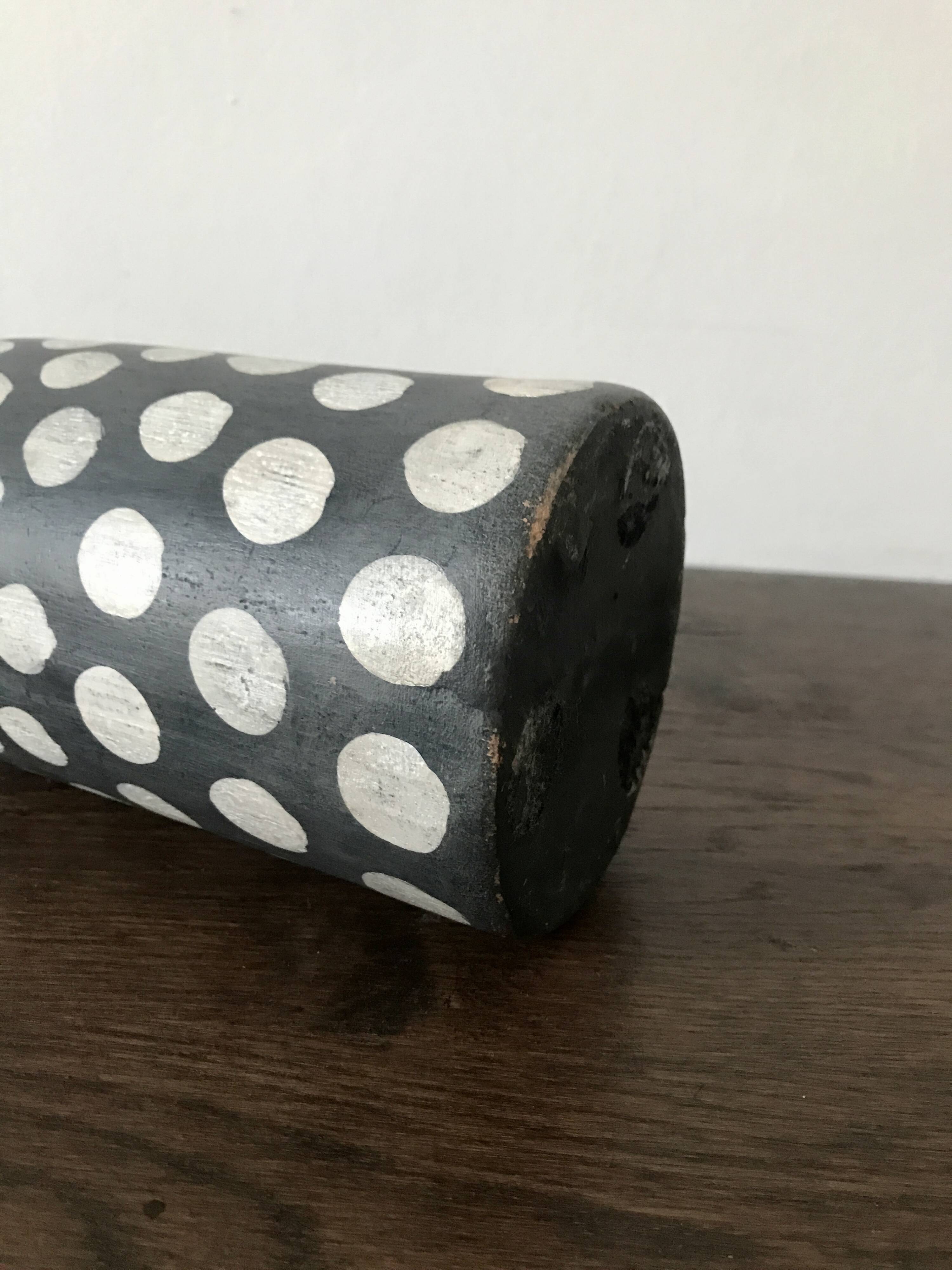 Terracotta vase painted with polka dots