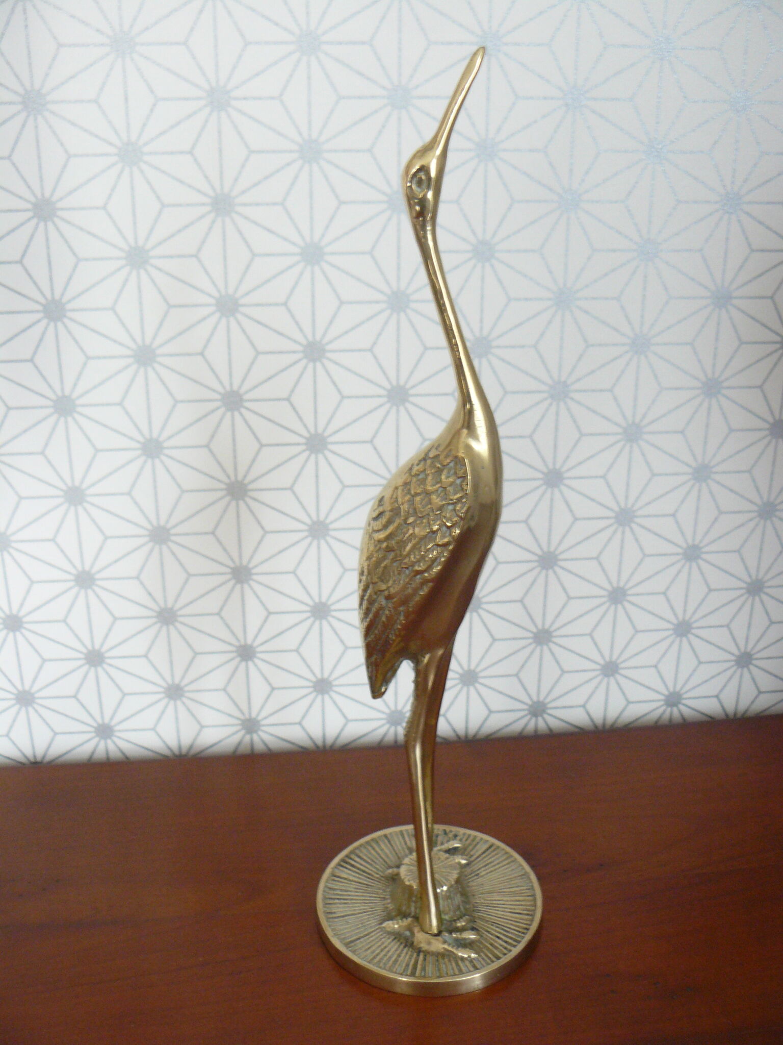 Heron in vintage brass