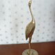 Heron in vintage brass