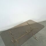 Smoked glass coffee table with gold-coloured legs from Sweden