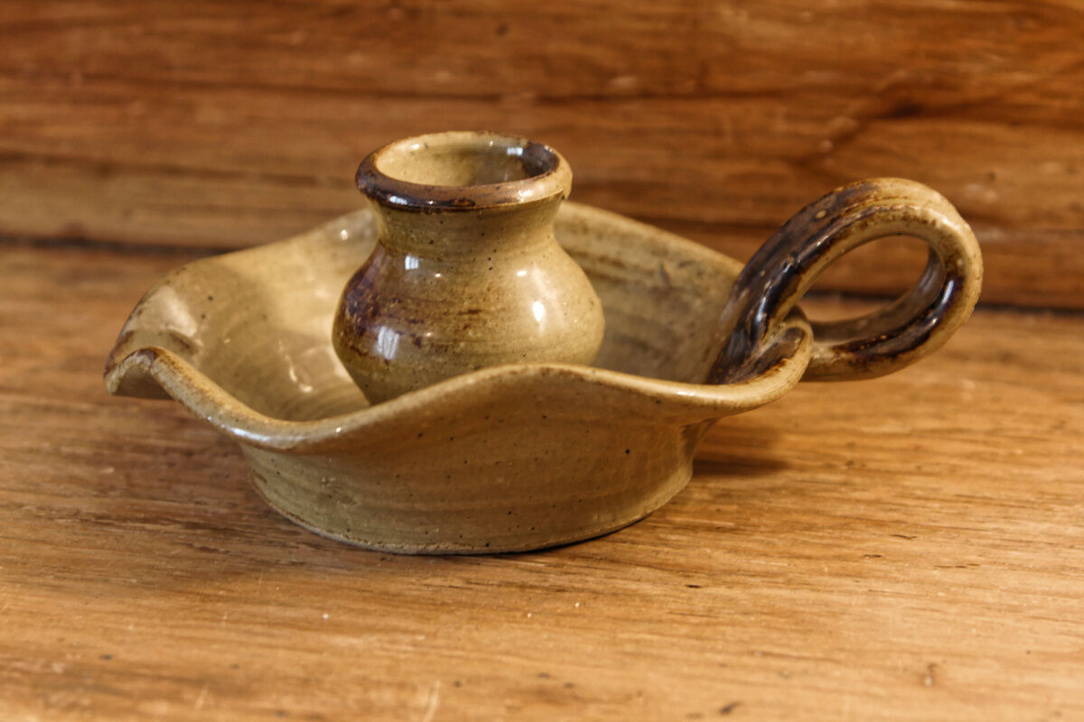 Signed sandstone candle holder