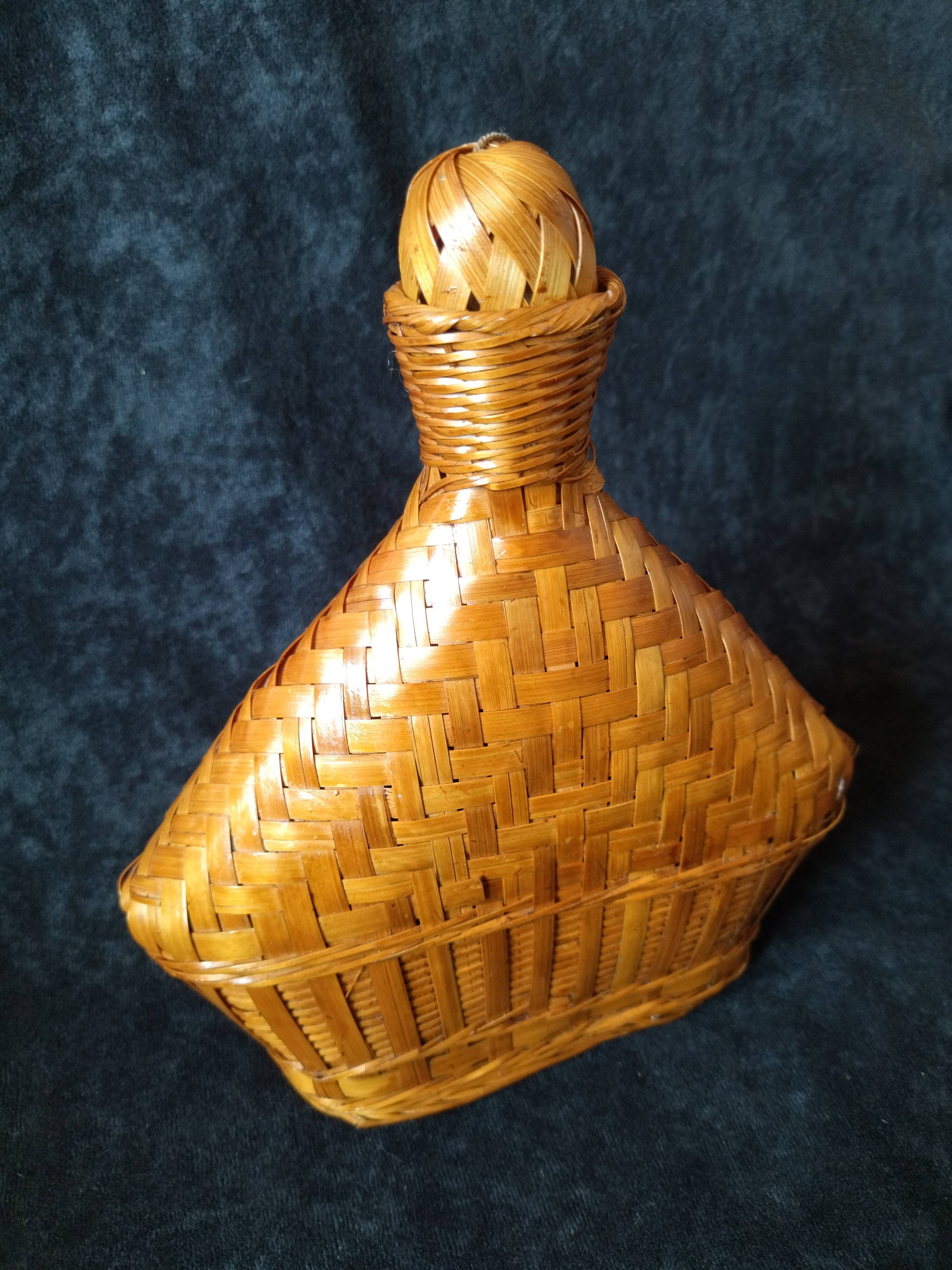 Vintage wicker and braided bamboo bottle