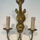 Pair of bronze wall sconces with dolphins by Maison Jansen