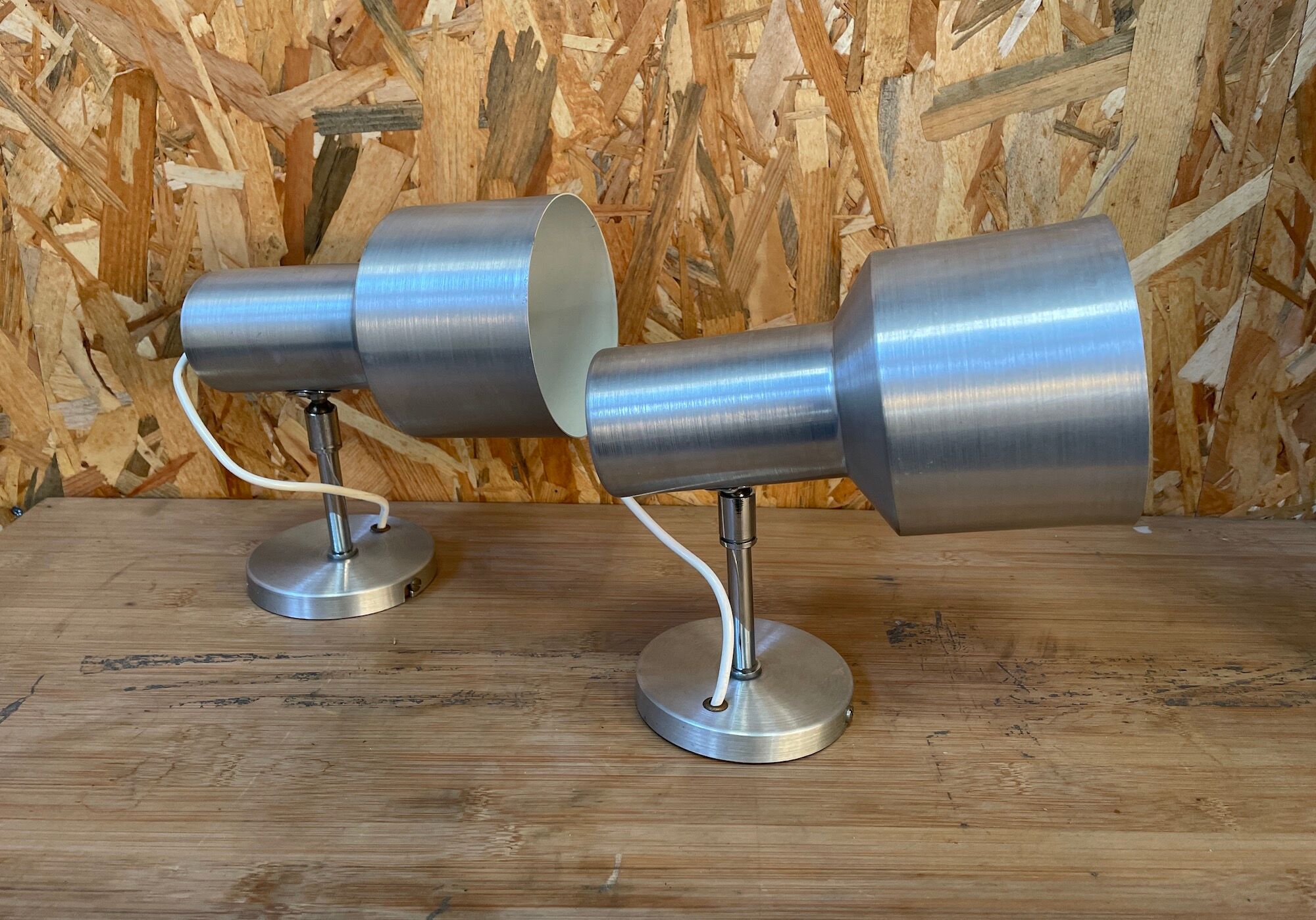 Pair of swivel brushed metal sconces