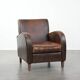 Vintage sheepskin leather design armchair in a dark cognac colour