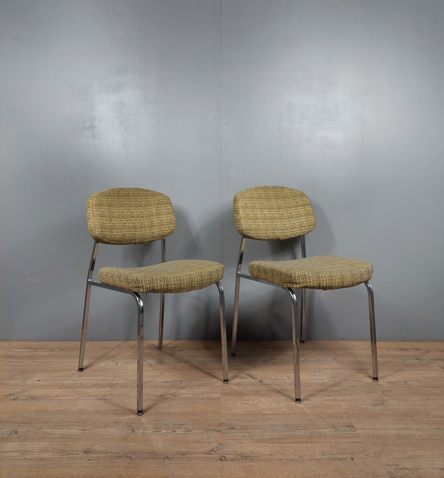 Pair of vintage chairs in fabrics and metal