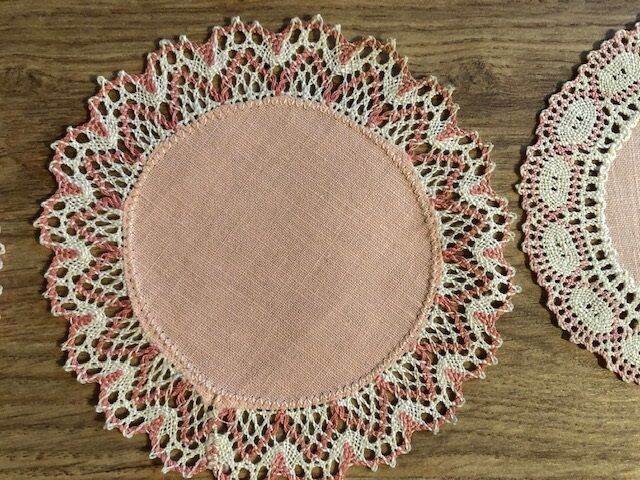 11 pink hand-lace coasters