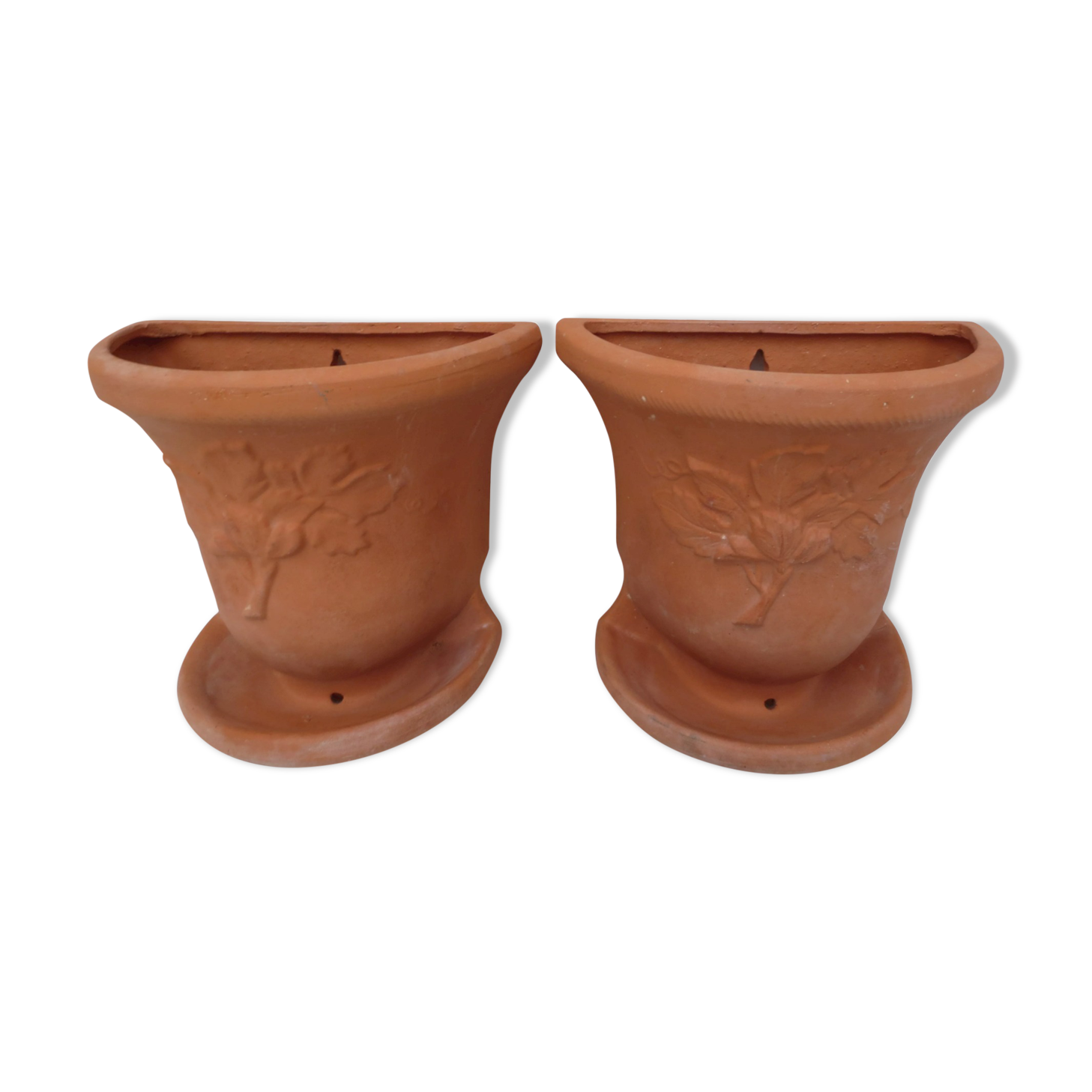Duo of decorated terracotta wall flowerpots