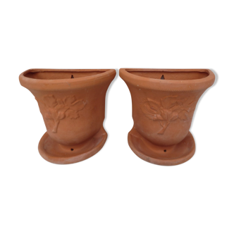 Duo of decorated terracotta wall flowerpots