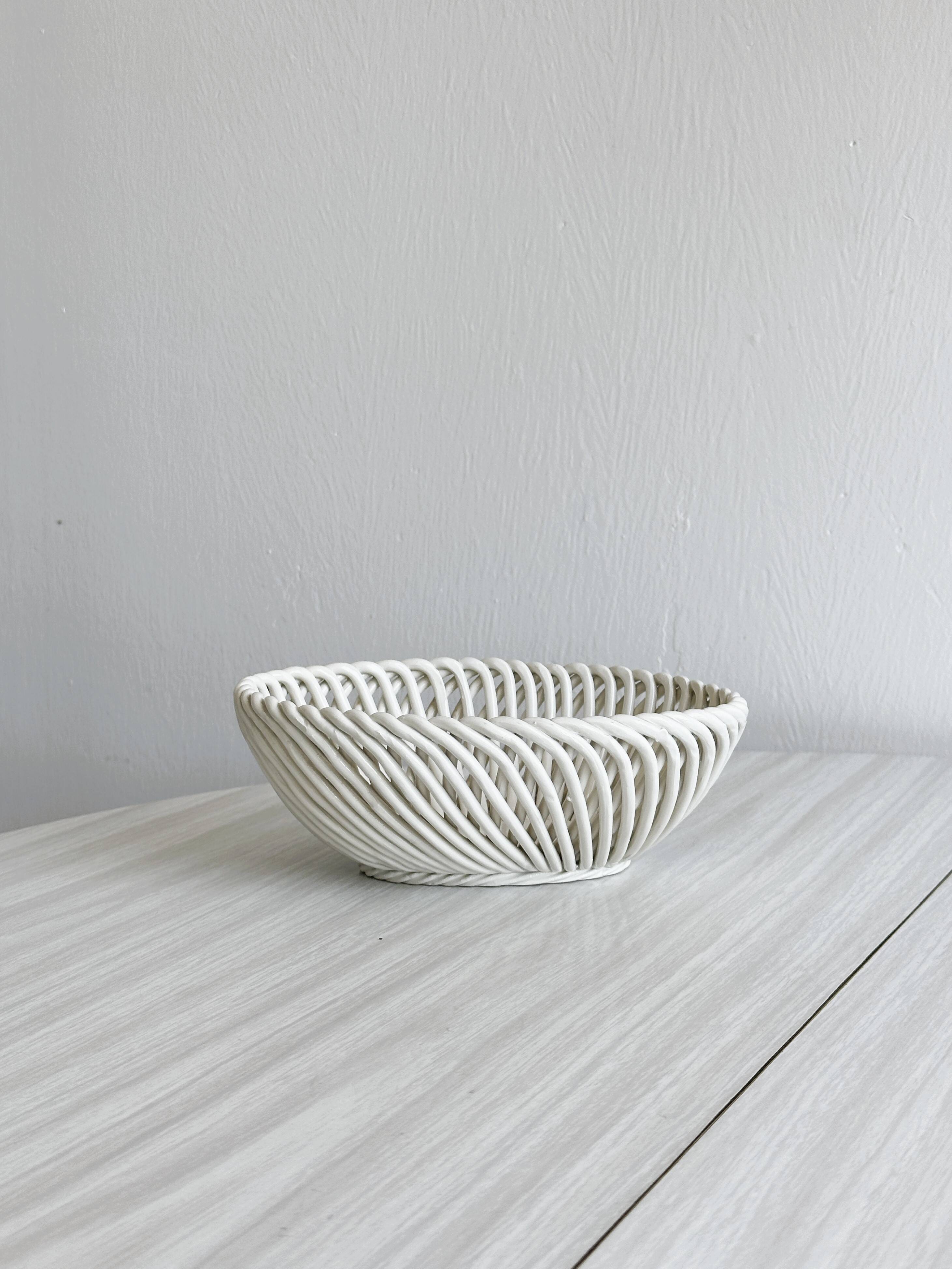 Small white ceramic twisted basket
