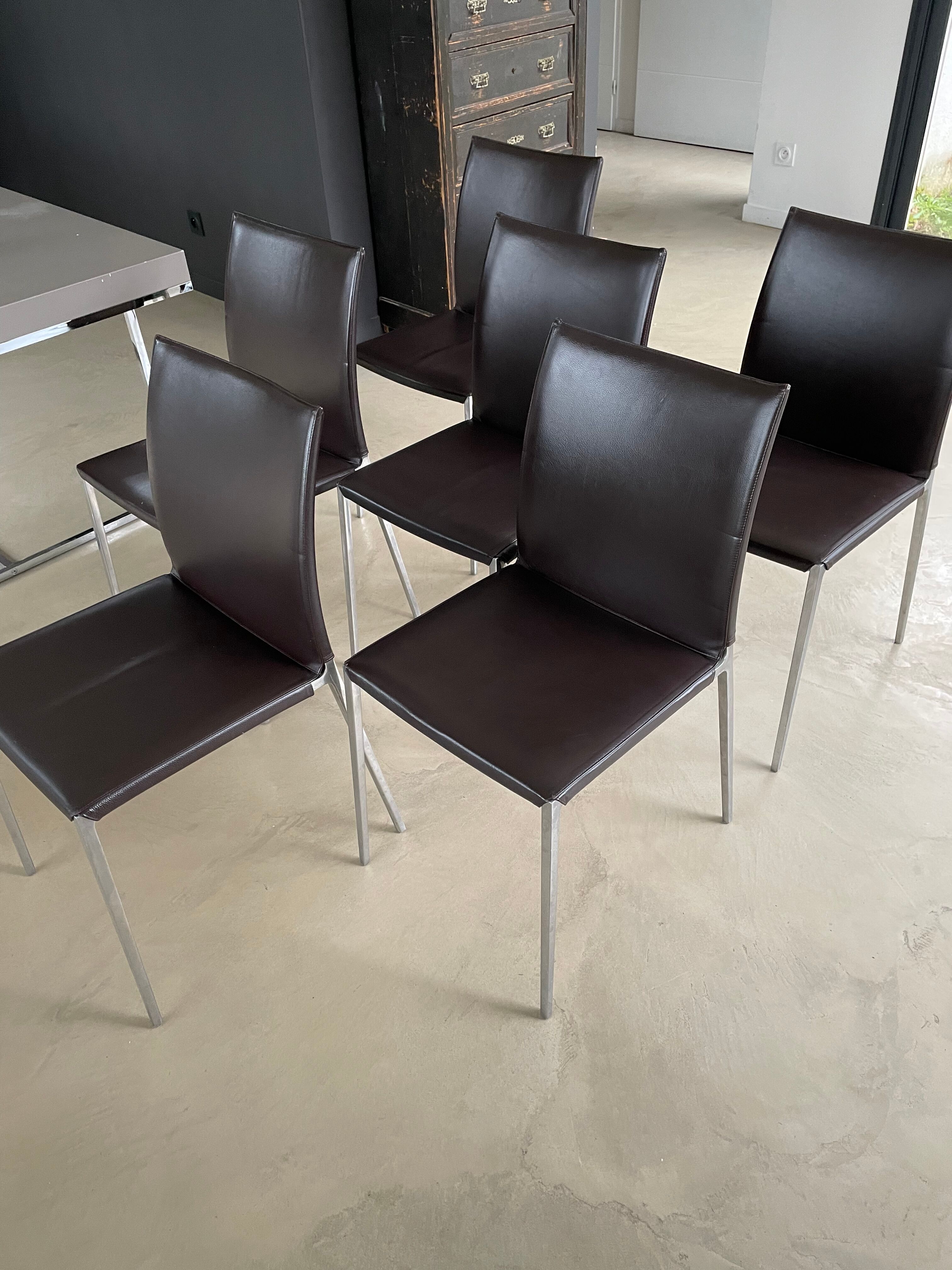 Brown leather chairs and Zanotta metal legs