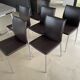 Brown leather chairs and Zanotta metal legs