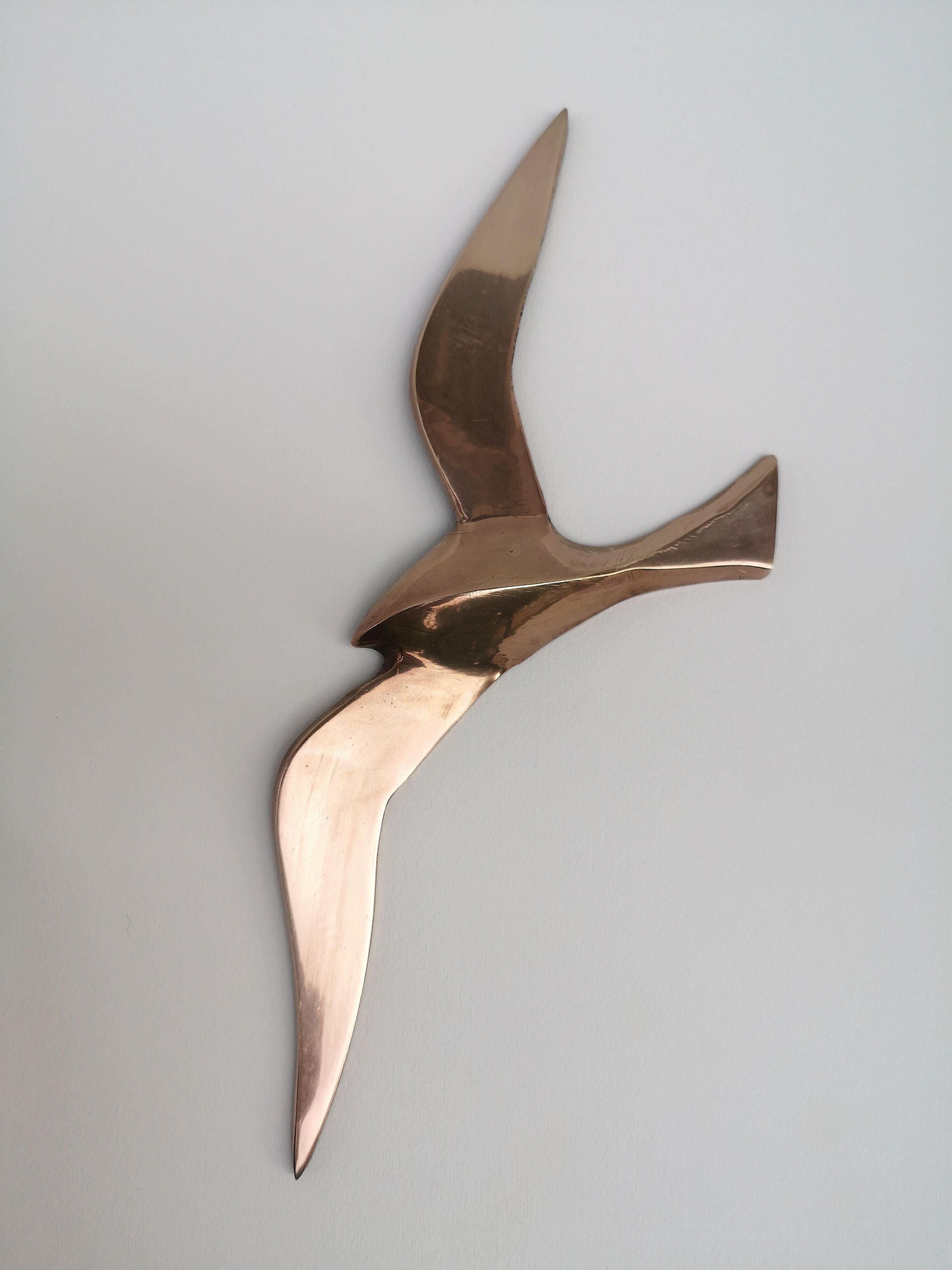 Stylized brass birds