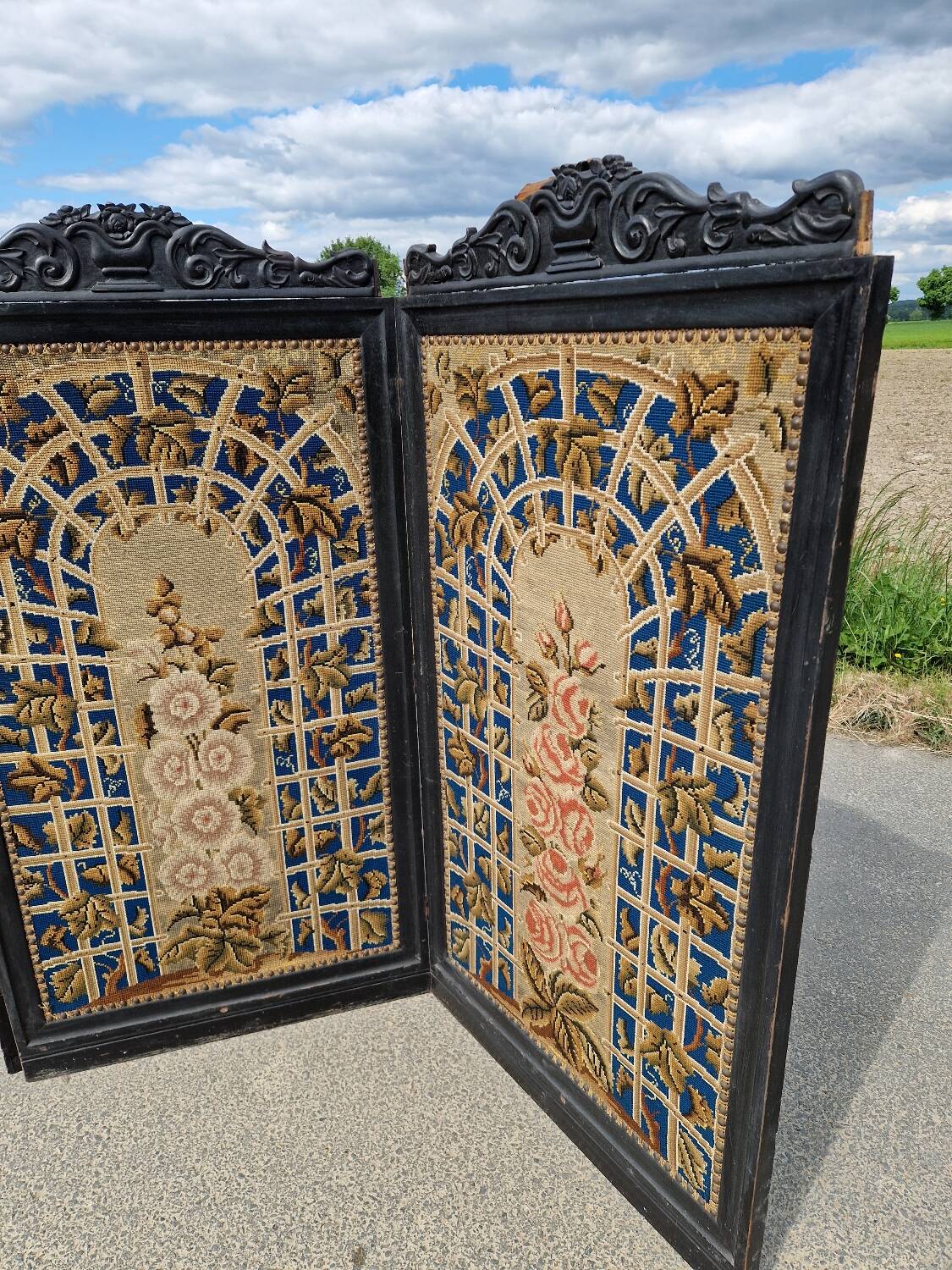 Folding screen in black-painted wood, 19th century