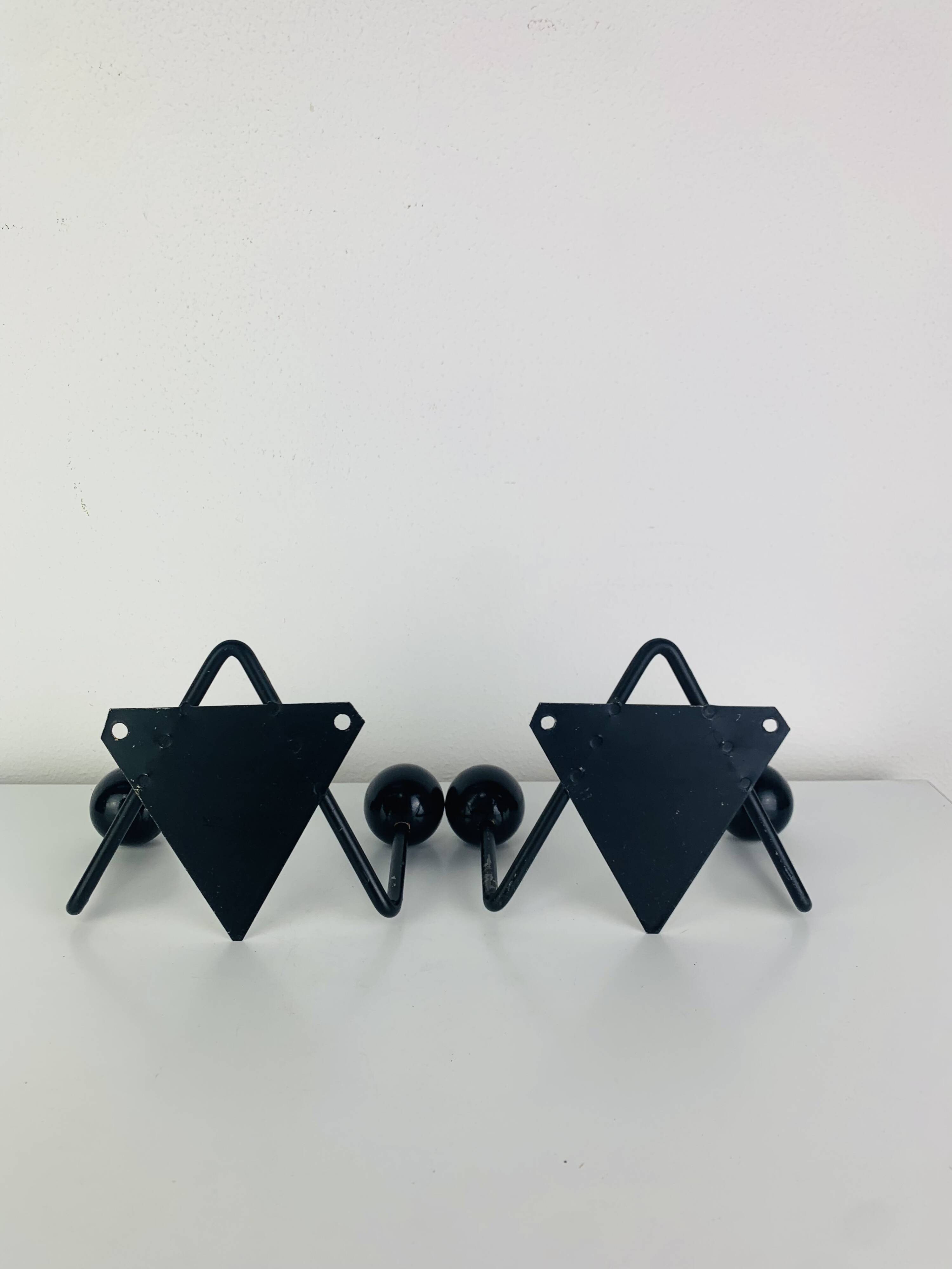 Pair of wall hooks from the 1950s, black metal