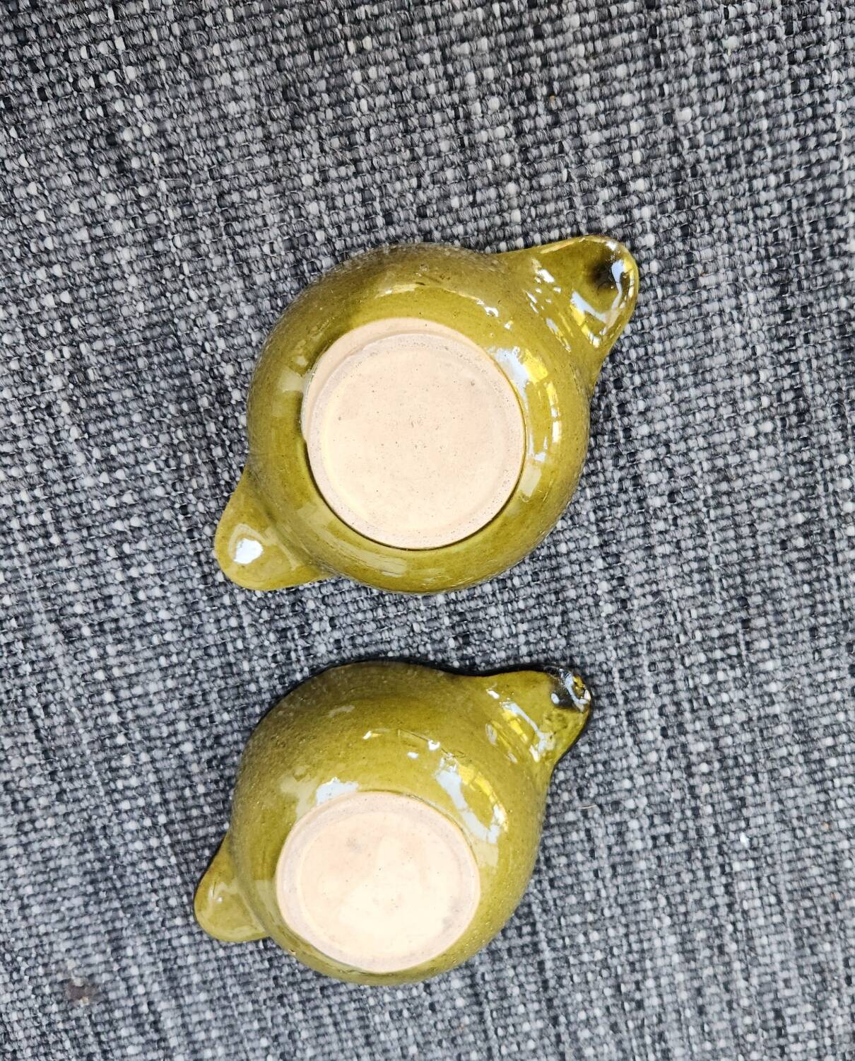 Set of 2 glazed khaki clay bowls.