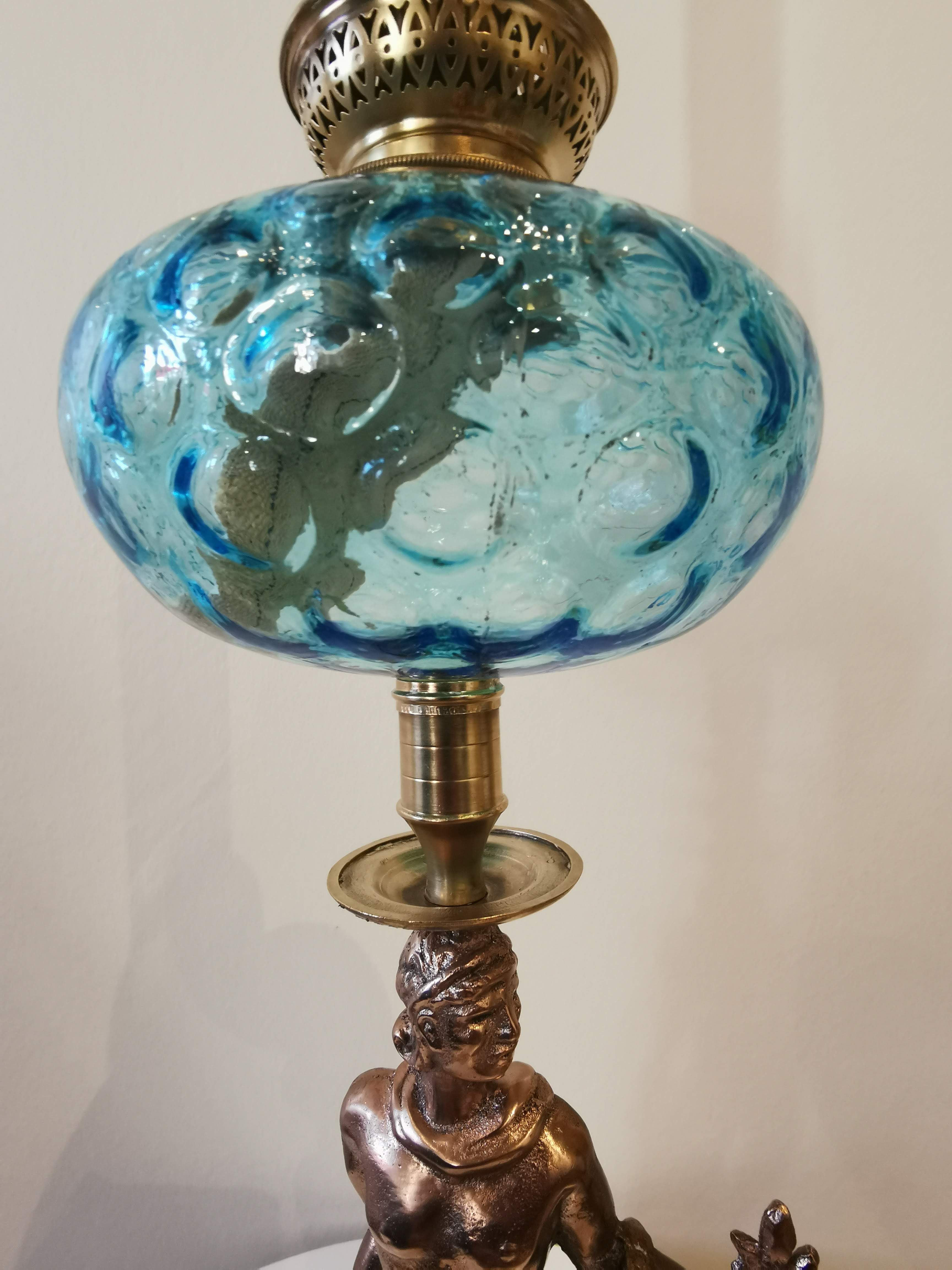Large kerosene lamp mounted on bronze statue. Late nineteenth century
