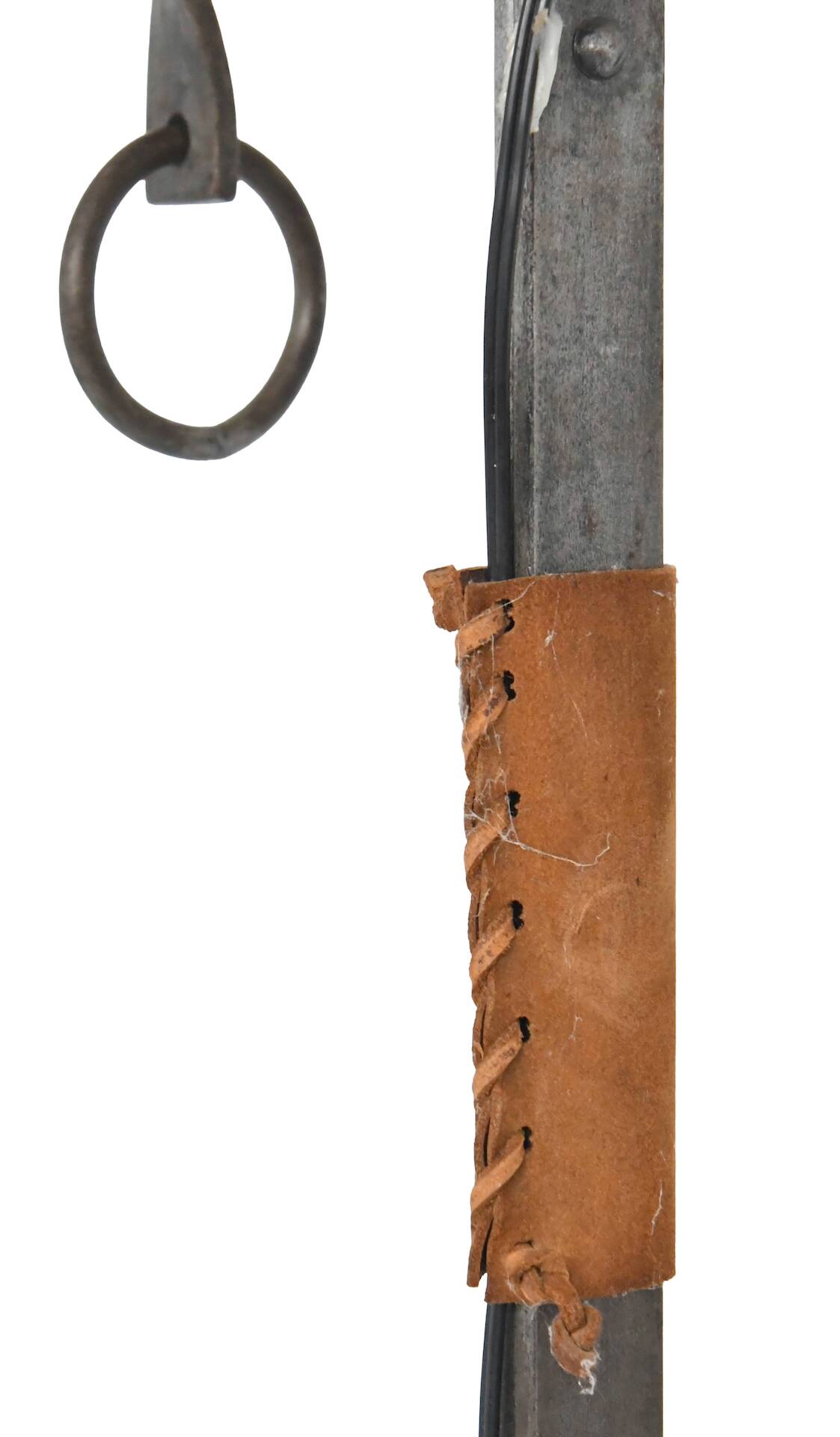 Wrought iron and leather floor lamp in the style of Jean-Pierre Ryckaert.