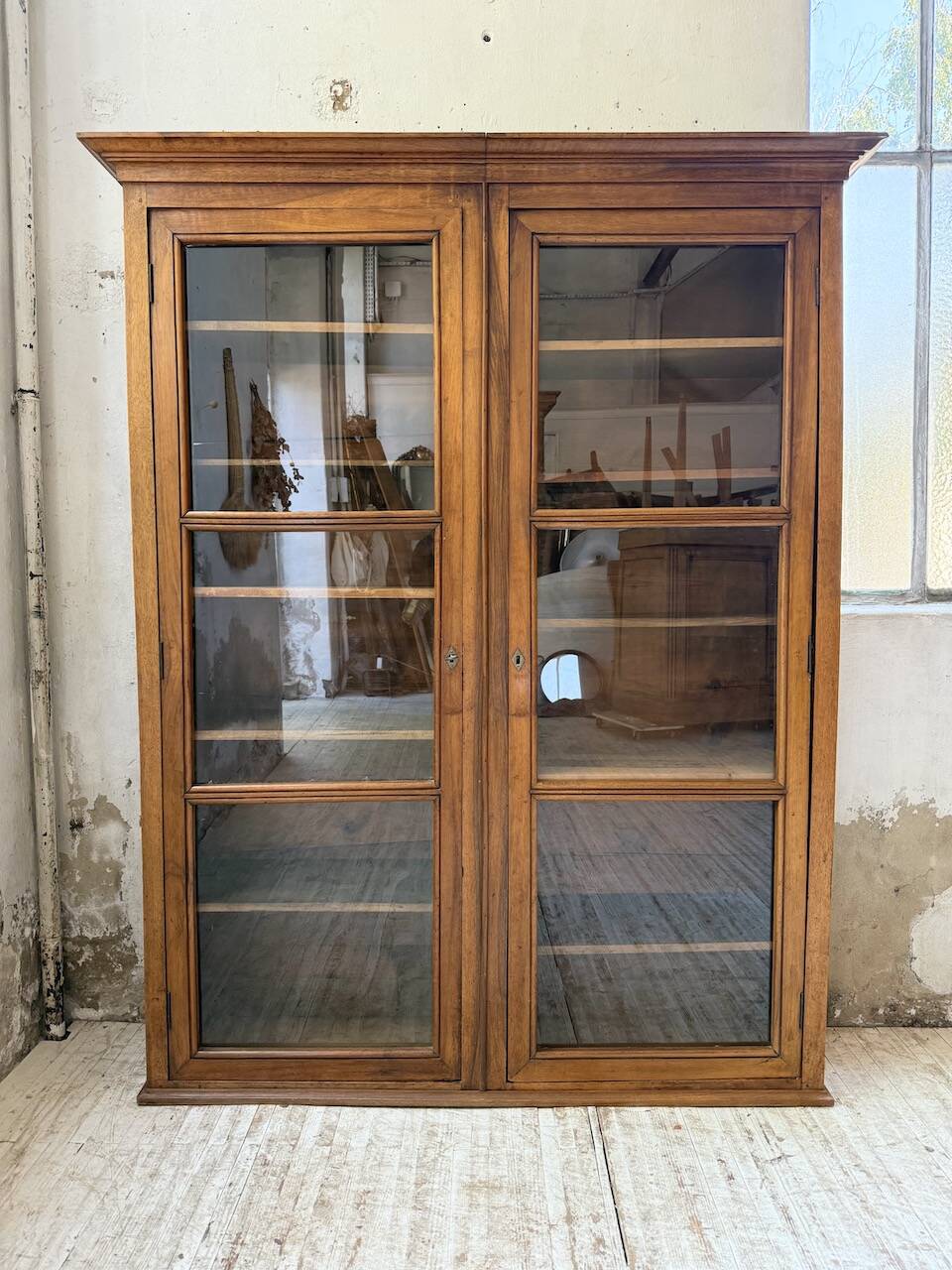 Glass-fronted walnut library 1900