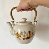 Vintage porcelain and rattan teapot