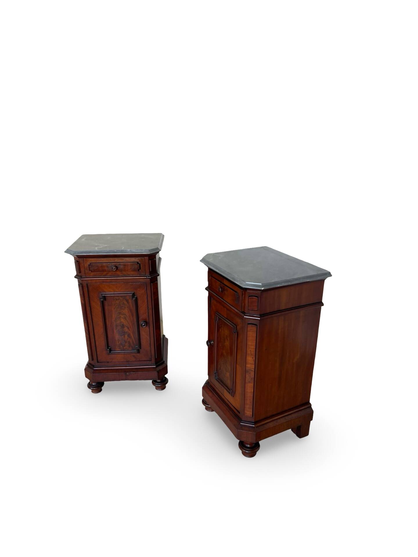 A pair of antique walnut bedside tables from the 1890s.