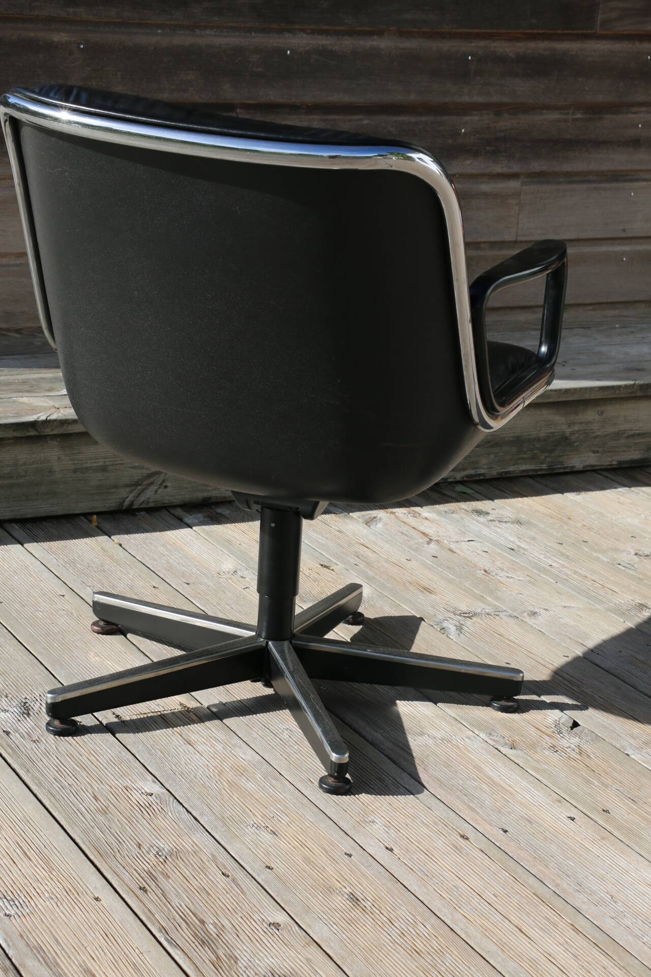 Pollock black leather reclining armchair with fixed ends