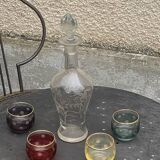 Liqueur carafe, or aperitif, carved with floral decoration in transparent glass and 4 polka dot glasses