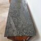 Empire/Restoration style console table with scrolled ends, mirrored back, and claw feet.