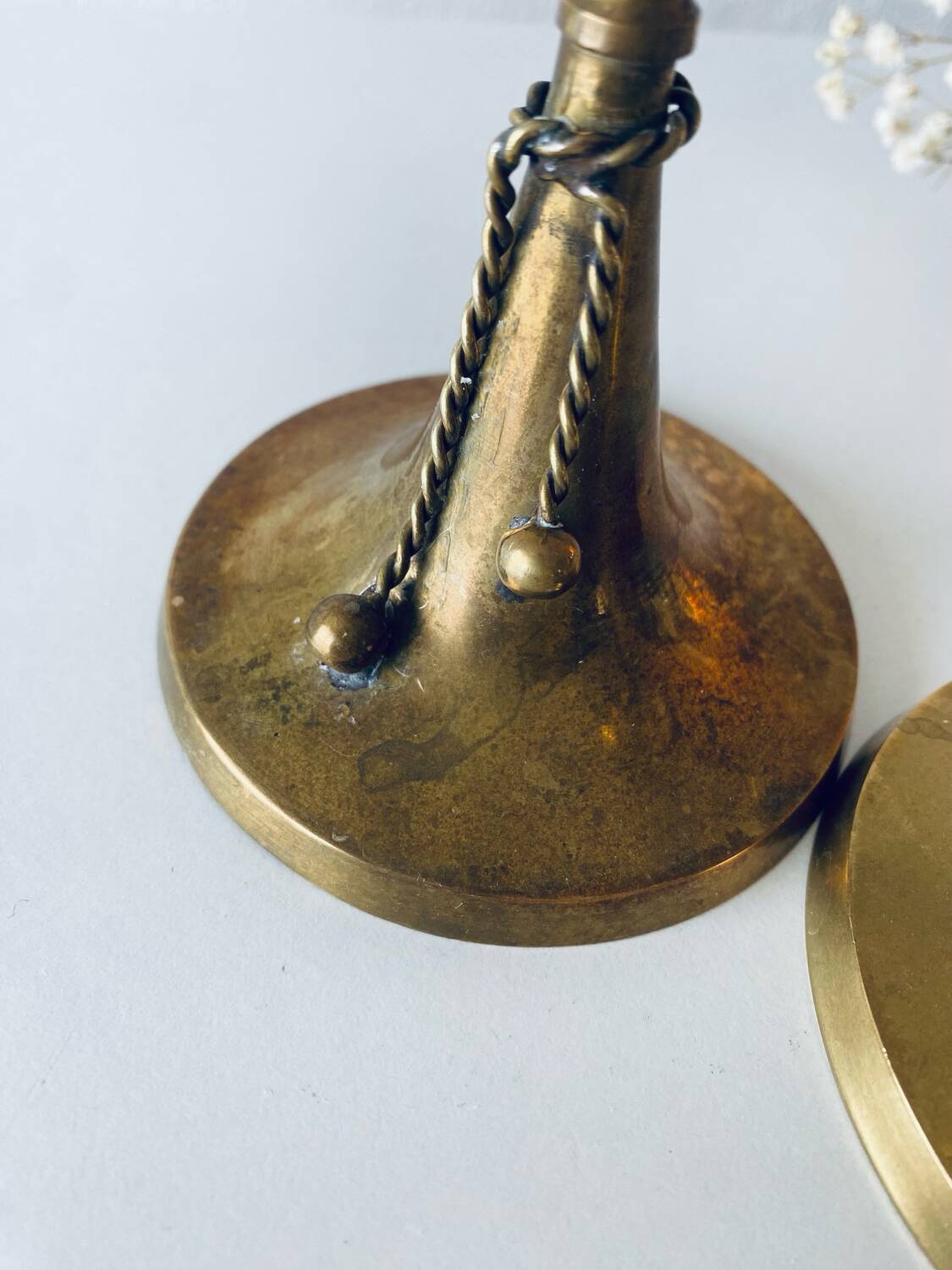 Pair of brass cord candle holders