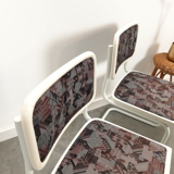 Pair of vintage tubular frame dining chairs