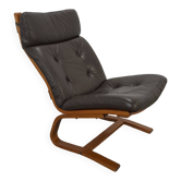 Bruin leren fauteuil avec houten onderstel