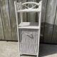 Small white wicker bathroom shelf